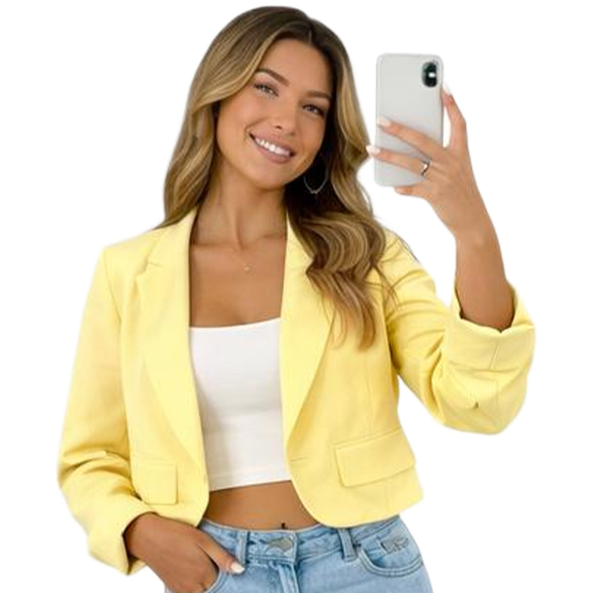 Woman wearing a yellow blazer taking a selfie on a white background