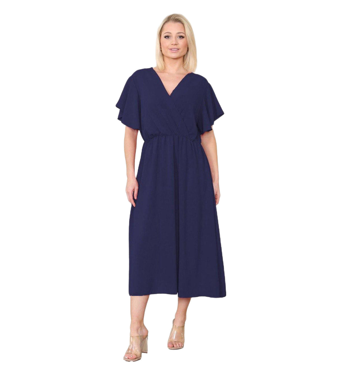 Woman wearing a navy blue dress on a white background