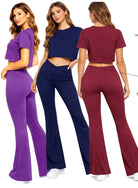 Three women modeling high-waist flare leggings and crop top sets in purple, navy blue, and burgundy colors. The image highlights product features including crossover waistband, non-see-through fabric, hidden storage pocket, seamless front design, 4-way stretch material, and flared leg style.