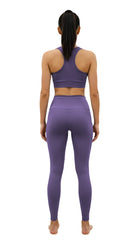 Person wearing a purple athletic outfit on a white background
