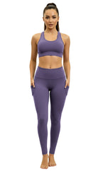 Woman wearing a purple athletic outfit on a white background