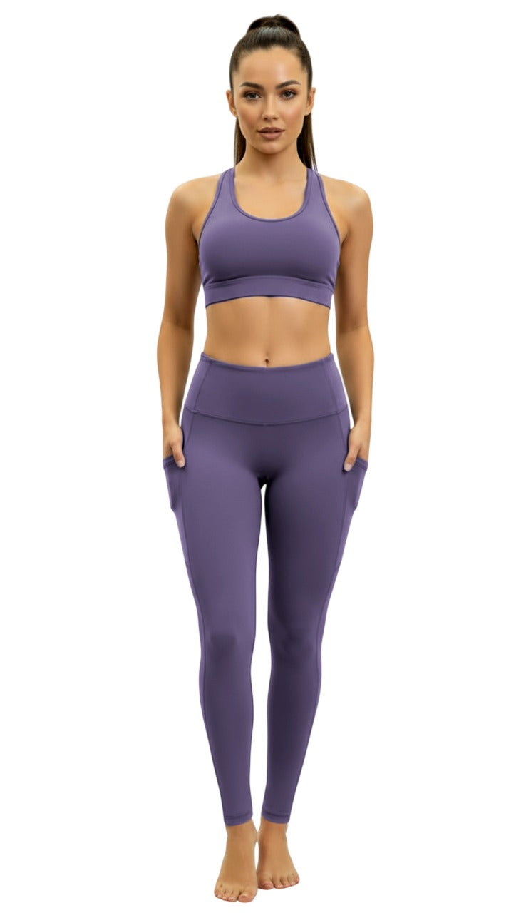 Woman wearing a purple athletic outfit on a white background