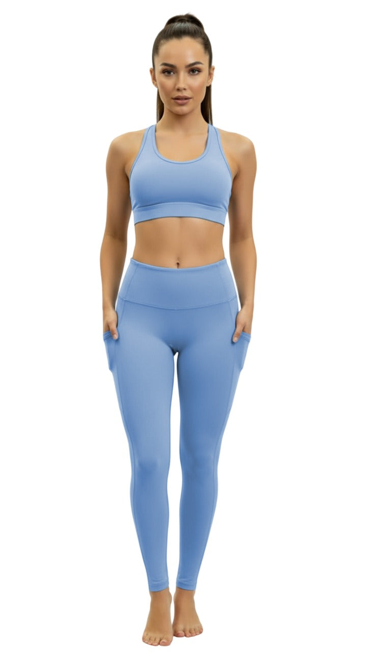 Woman wearing a blue athletic outfit on a white background