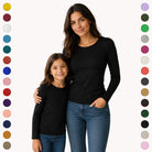 Two people wearing black long-sleeve shirts with color swatches on the sides.