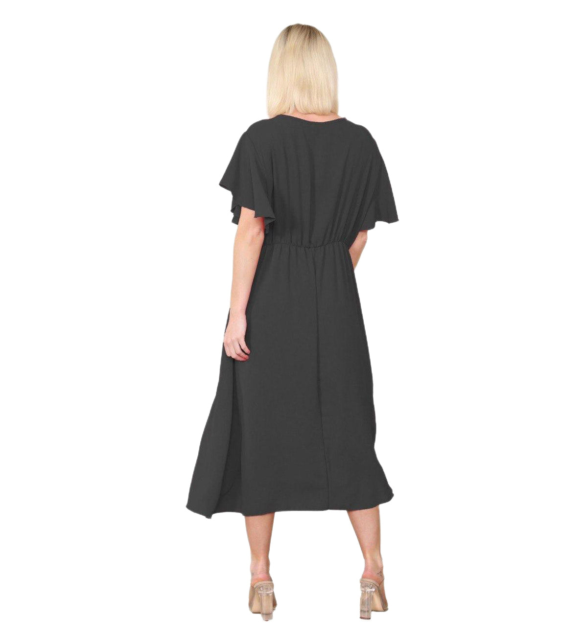 Woman wearing a black dress with cape sleeves on a white background